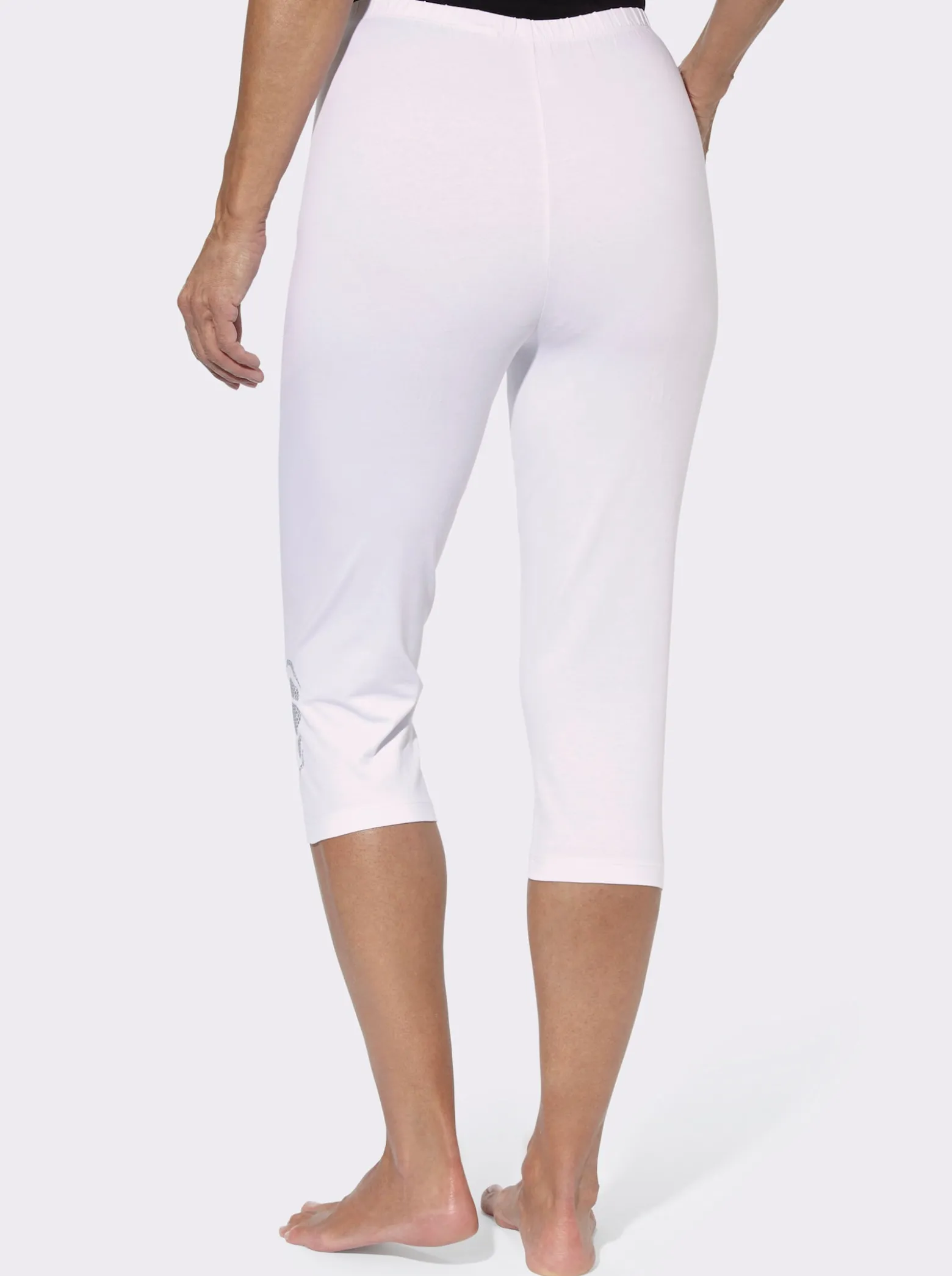 Caprileggings mit Glitzerdruck am Saum