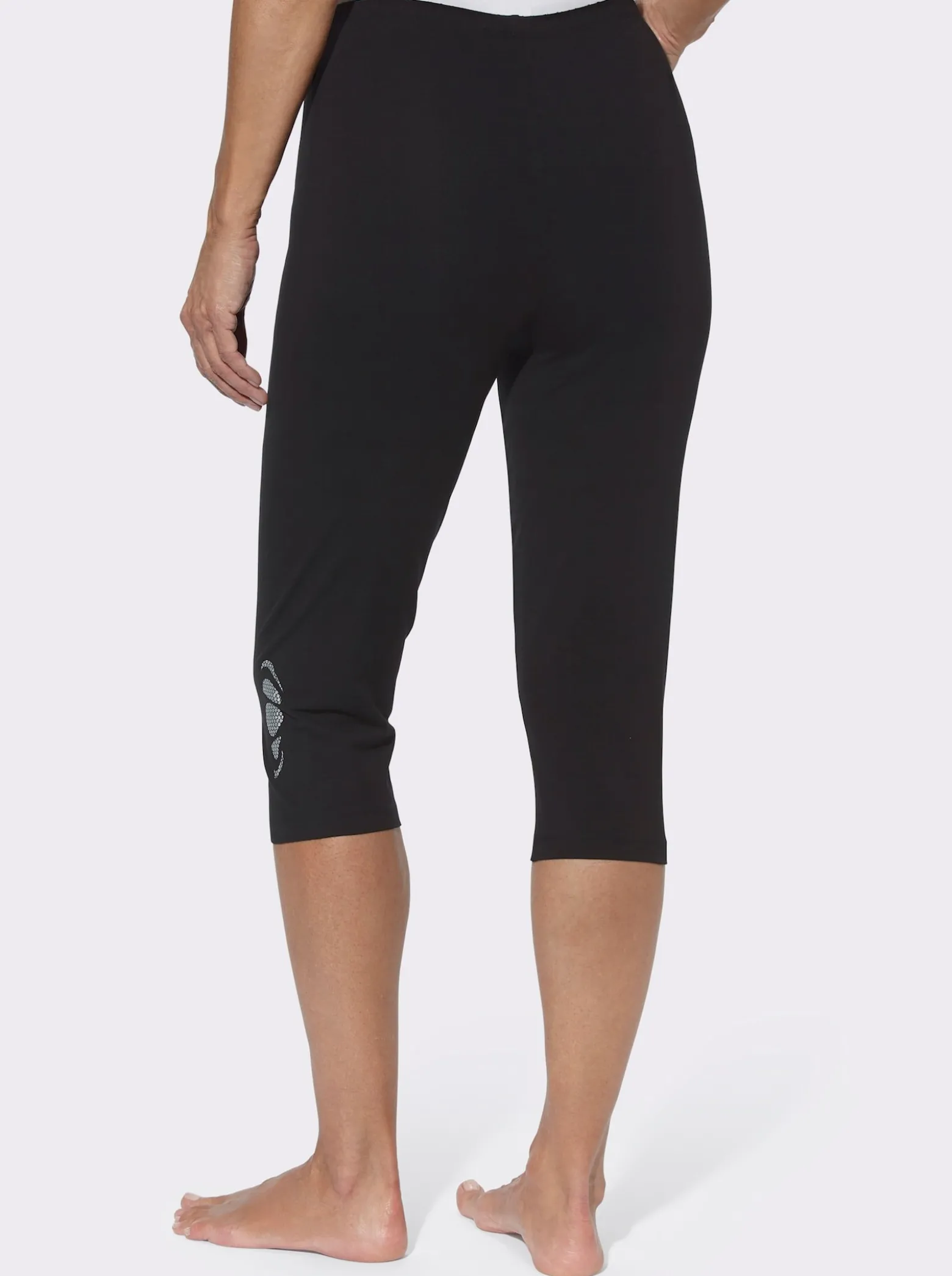 Caprileggings mit Glitzerdruck am Saum