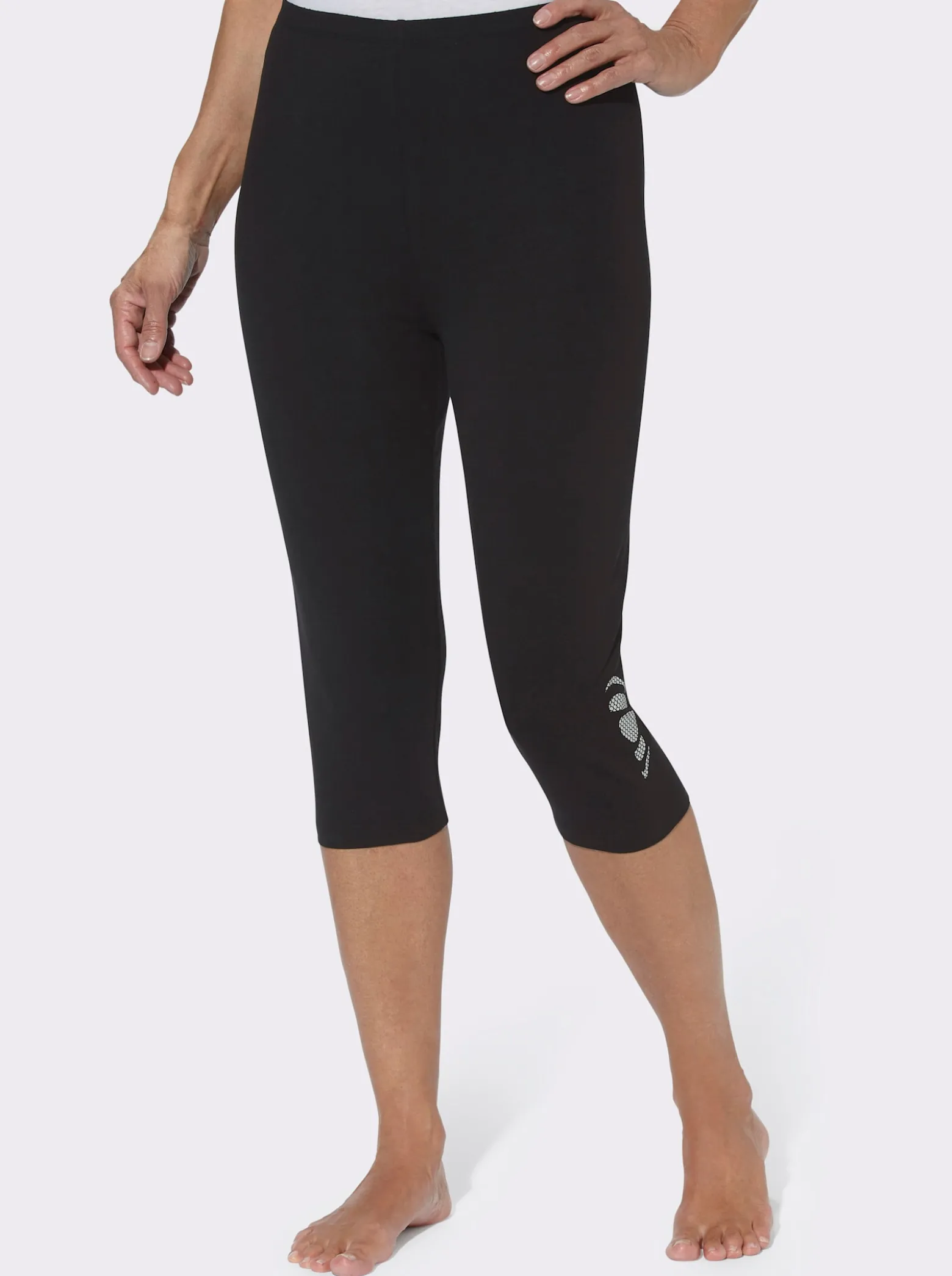 Caprileggings mit Glitzerdruck am Saum